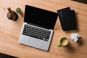 blogging desk with laptop and coffee